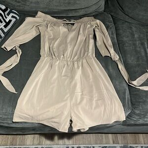 Light brown romper size small, quarter sleeve with ties at the end